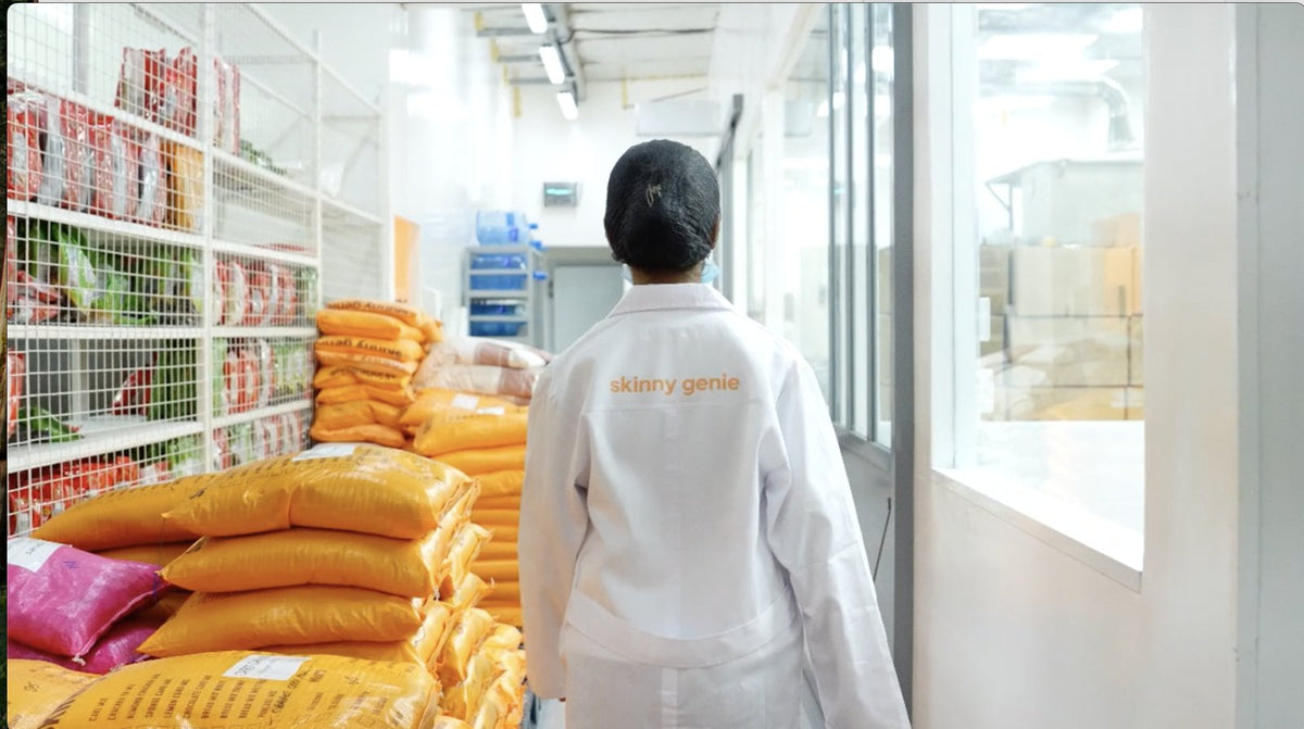 Skinny Genie staff member walking through the dedicated gluten-free production facility in Al Quoz, Dubai