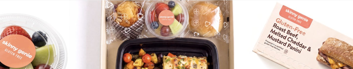 Gluten-free airline meal box with fruit cup, muffin, bread roll, hot tray meal and a labelled sandwich box